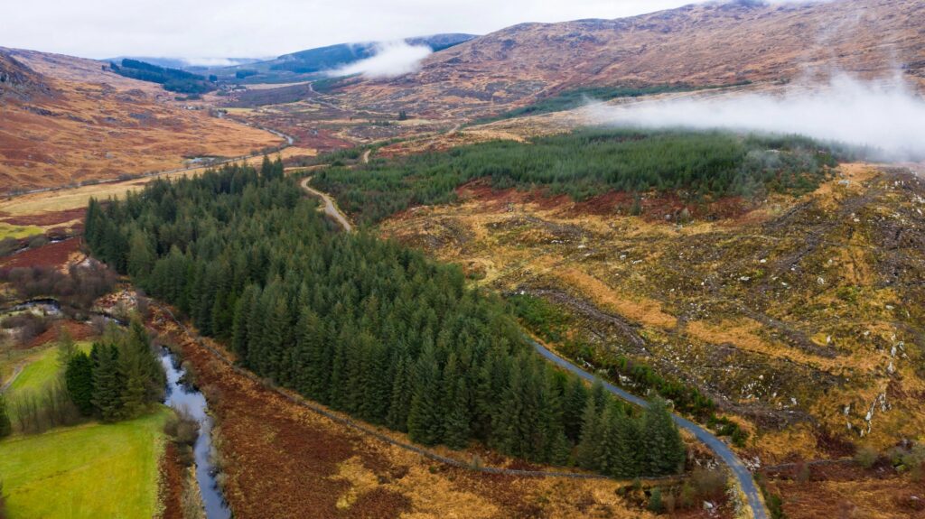 Aerial view of low cloud and mist on a Scottish hillside in rural Dumfries and Galloway